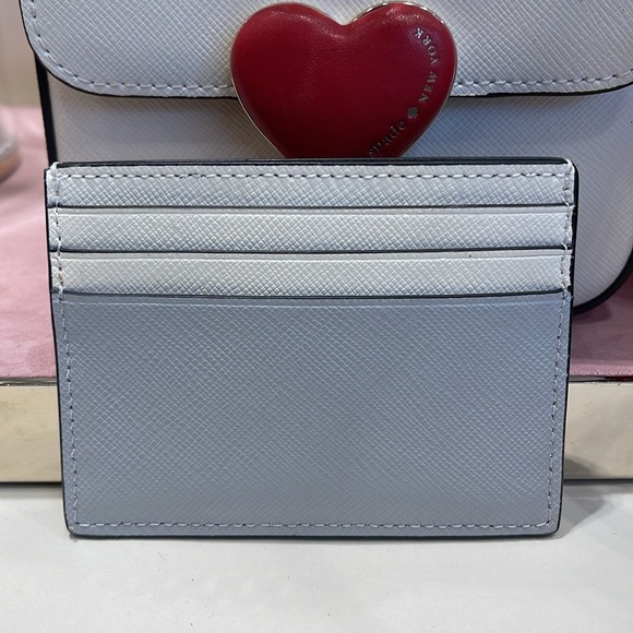 Kate Spade Madison Small Slim Card Holder
Platinum Grey Multi
NWT - Picture 4 of 16